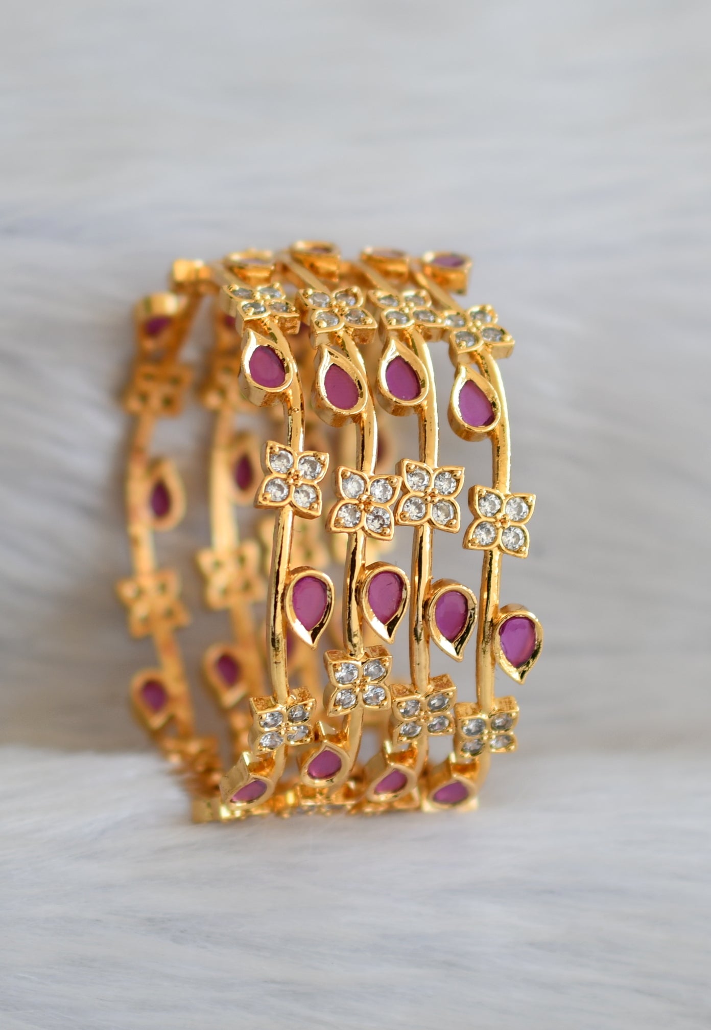 Gold tone ruby-white stone set of 4 Bangles (2.8) dj-40697