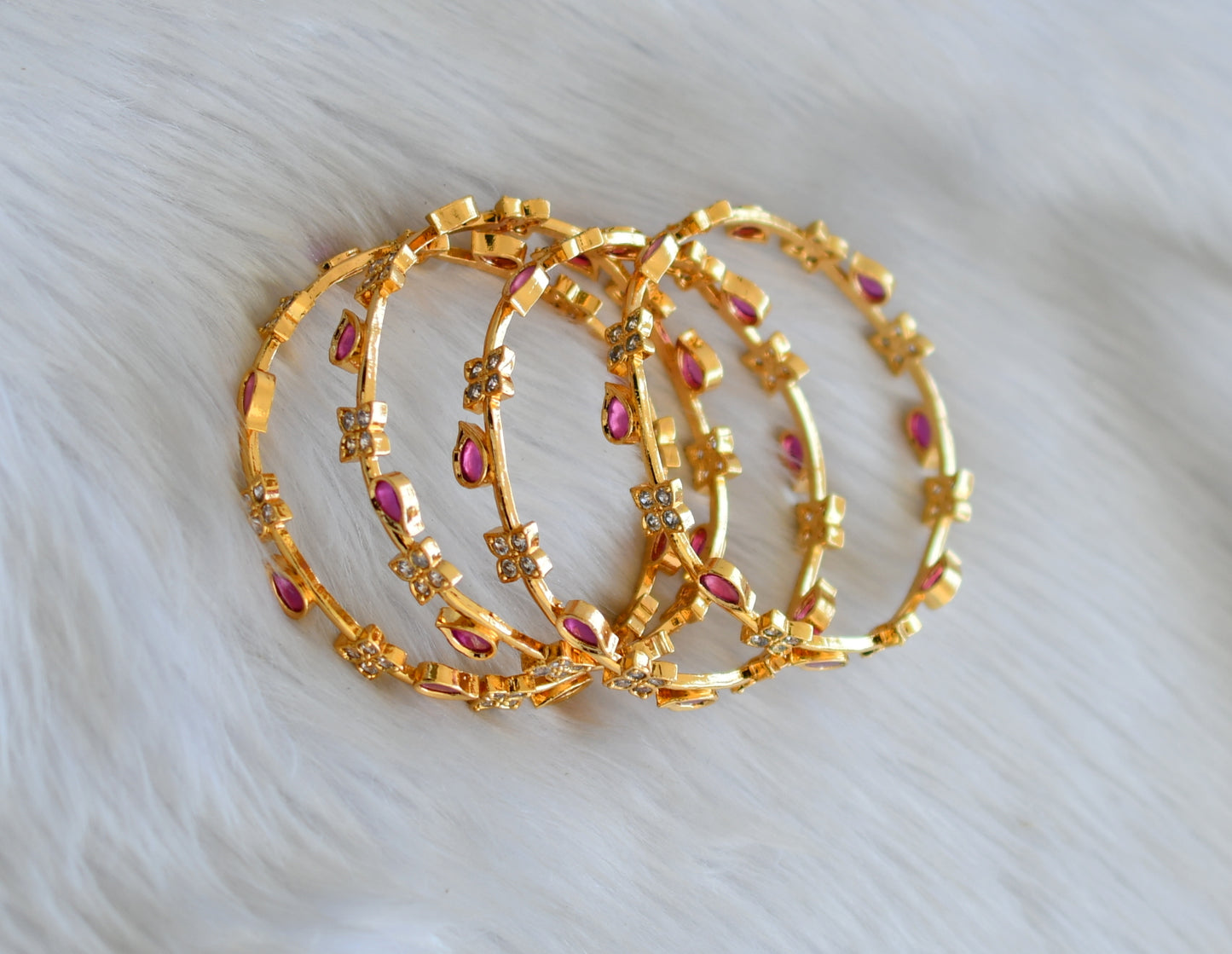 Gold tone ruby-white stone set of 4 Bangles (2.8) dj-40697