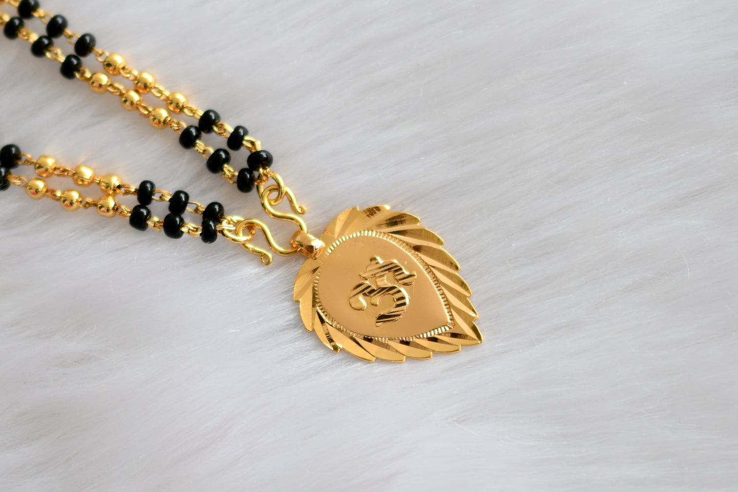 Gold tone 'om' pendant with double layer karimani mala dj-38590