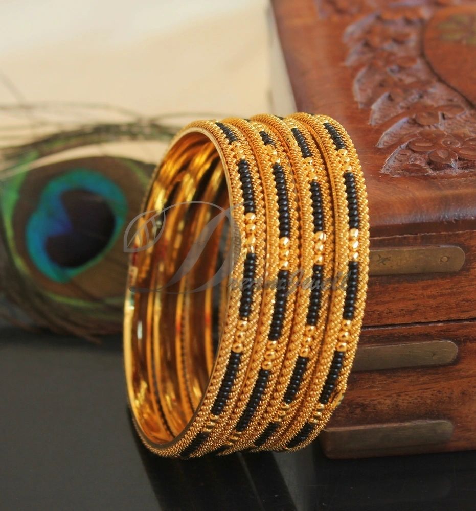 Twined karimani bangle.. wuth elephant heads.. - Gujjadi swarna jewellers |  Gold bangles design, Pearl bangles gold, Gold earrings models