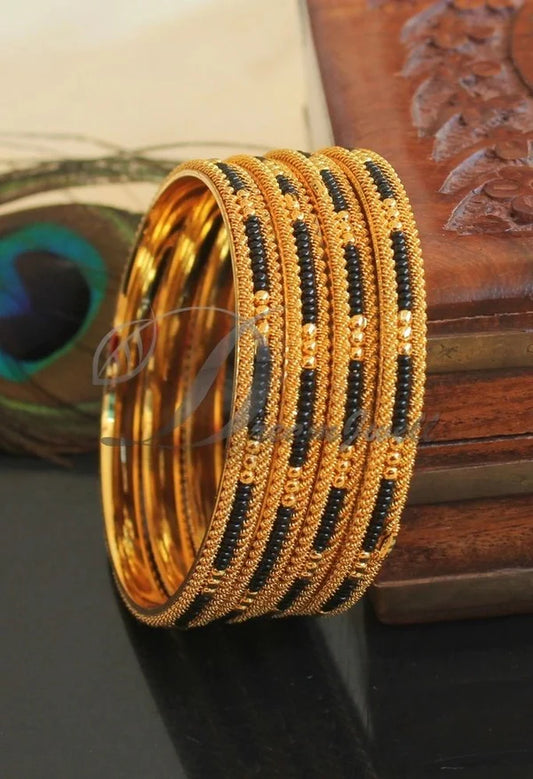 Gold tone set of 4 karimani bangles(2.10) dj-38882